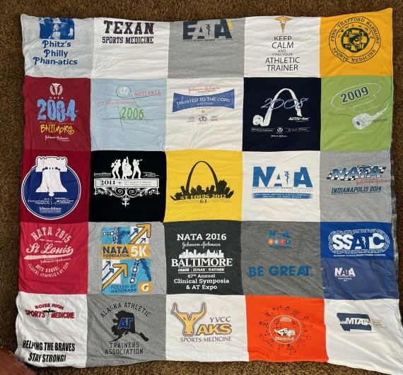 A 10x10 quilt made out of t-shirts.